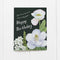 You Flourish More With Every Year - Floral Birthday Card featuring watercolor magnolia and poppy illustrations, blank inside, folded, with a heartfelt message on the front.
