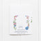 Trans Coming Out Card featuring watercolor flowers inspired by the trans pride flag, designed to celebrate LGBTQIA+ pride. Blank inside, includes a kraft envelope.