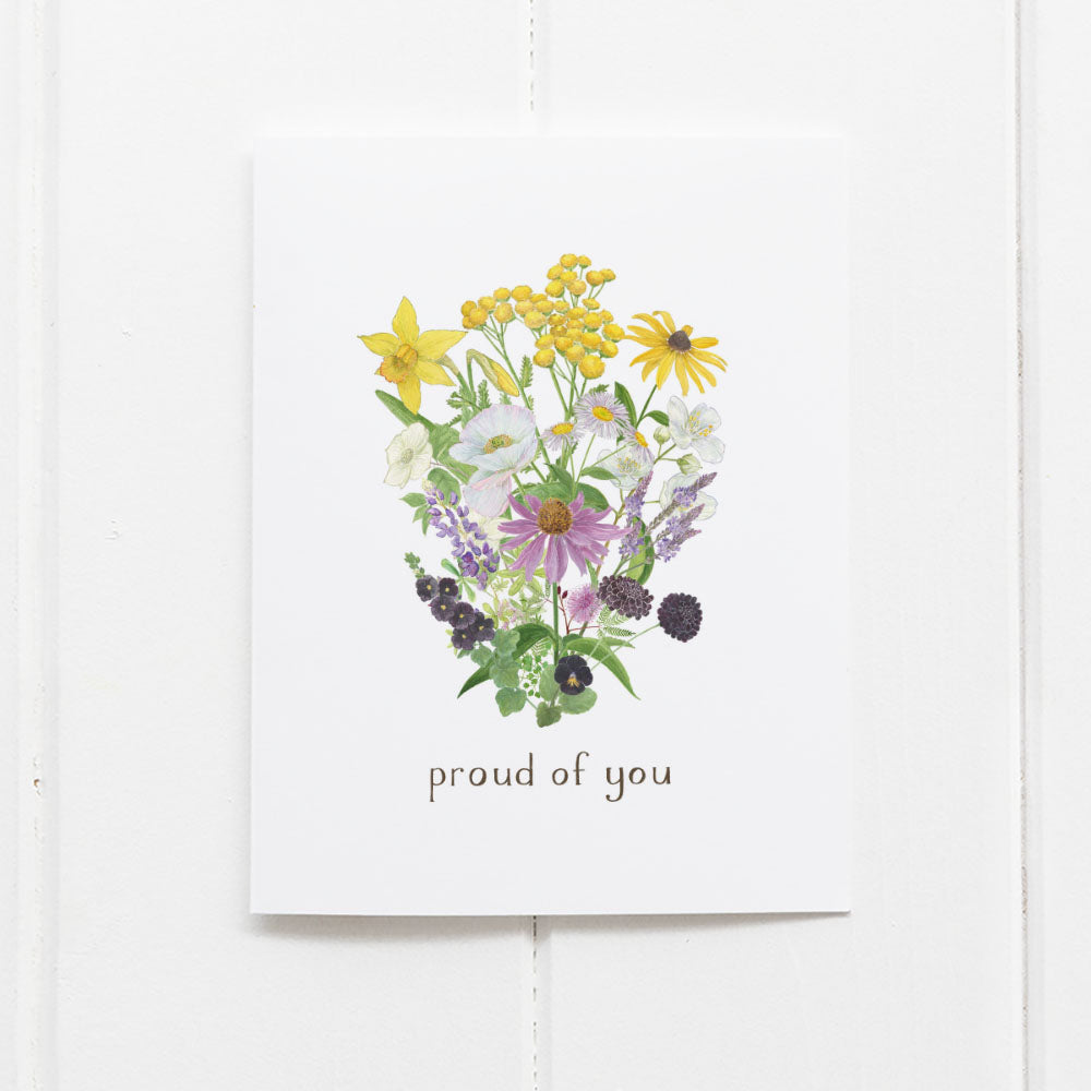 Nonbinary Pride Bouquet Card featuring a floral design with proud of you text, illustrated by Brigida Swanson, blank inside with kraft envelope.
