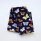 Butterflies Tea Towel - Organic Cotton Kitchen Towel featuring watercolor butterflies on a deep purple background, folded to showcase its vibrant pattern.