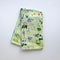 Wildflowers Tea Towel - Organic Cotton Kitchen Towel showcases a watercolor floral pattern, perfect for adding a natural touch to your kitchen.