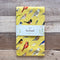 Backyard Birds Tea Towel - Organic Cotton Kitchen Towel featuring watercolor birds on a yellow background, perfect for adding nature-inspired charm to your kitchen tasks.