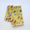 Backyard Birds Tea Towel - Organic Cotton Kitchen Towel featuring watercolor birds on a yellow background, ideal for drying dishes and adding nature-inspired charm to your kitchen.