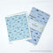 Ferry Tea Towel - Organic Cotton Kitchen Towel with dolphin and ferry motif, shown alongside a matching Swedish dishcloth, both featuring Yardia's Pacific Northwest-inspired design.