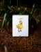 lucky card with yellow duckling on forest background