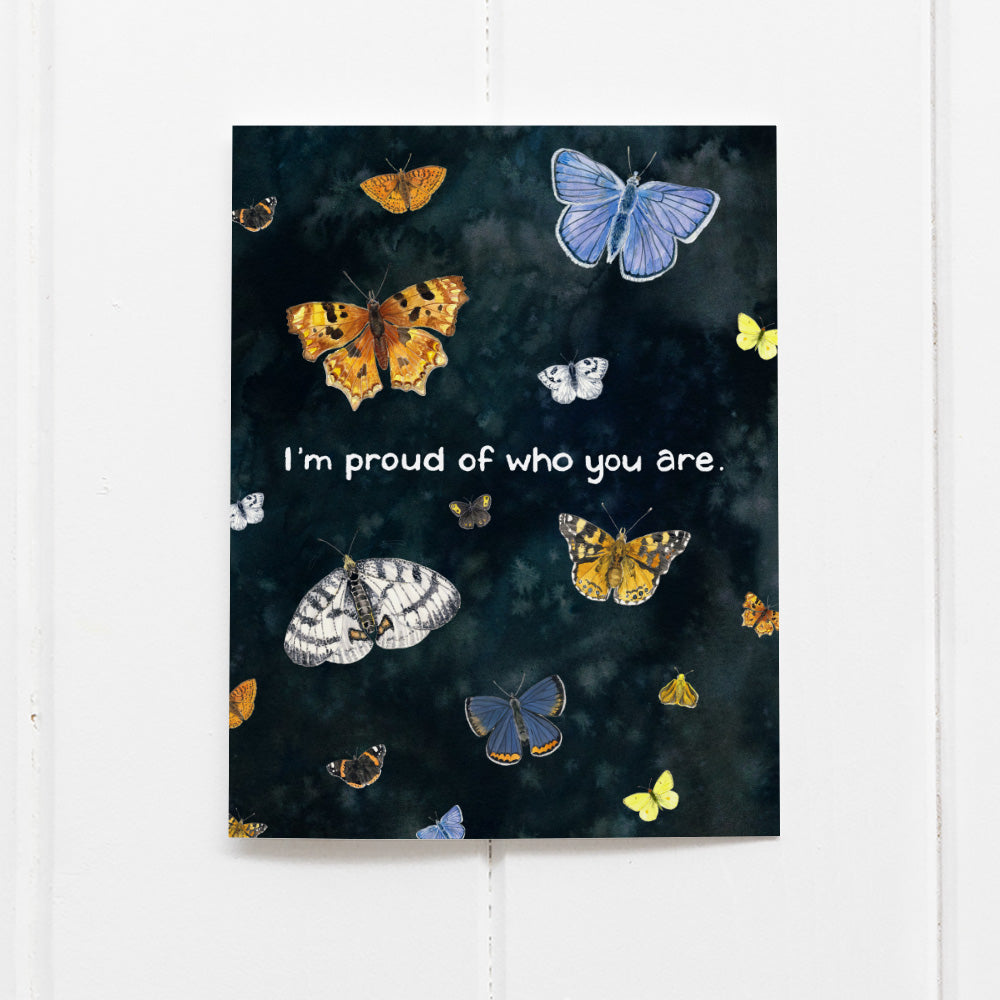 I'm Proud of Who You Are Card featuring Pacific Northwest butterflies on a black background, illustrating pride and identity, designed by Seattle artist Brigida Swanson.