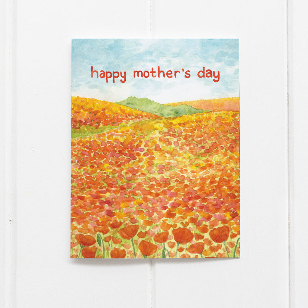 Happy Mother's Day Card with poppies features a watercolor of California poppies on hillsides, printed on recycled cardstock, blank inside, includes a kraft envelope.