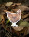 chicken laptop sticker on autumnal background