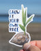Person holding the Grow At Your Own Pace Coconut Sticker, featuring a watercolor sprouting coconut and hand-lettered text, inspired by CHamoru heritage.
