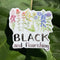 Black And Flourishing Sticker featuring watercolor wildflowers with hand-lettered message, perfect for personalizing items like water bottles and laptops. Weatherproof and dishwasher safe.