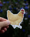 Buff Orpington Hen - Watercolor Chicken Sticker held in a hand, showcasing a vibrant hen illustration ideal for decorating laptops or water bottles.