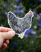 Hand holding the Barred Rock Hen - Watercolor Chicken Sticker, featuring a detailed illustration of Esther the hen, perfect for personalizing laptops or water bottles.