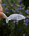 Hand holding a Gray Whale - Watercolor Coastal Nature Sticker, showcasing a gray whale illustration, ideal for ocean lovers and part of Yardia's nature-inspired collection.