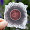 Hand holding a Lunar Eclipse - Watercolor Moon Sticker, depicting a super blood moon lunar eclipse, designed by Seattle artist Brigida Swanson.