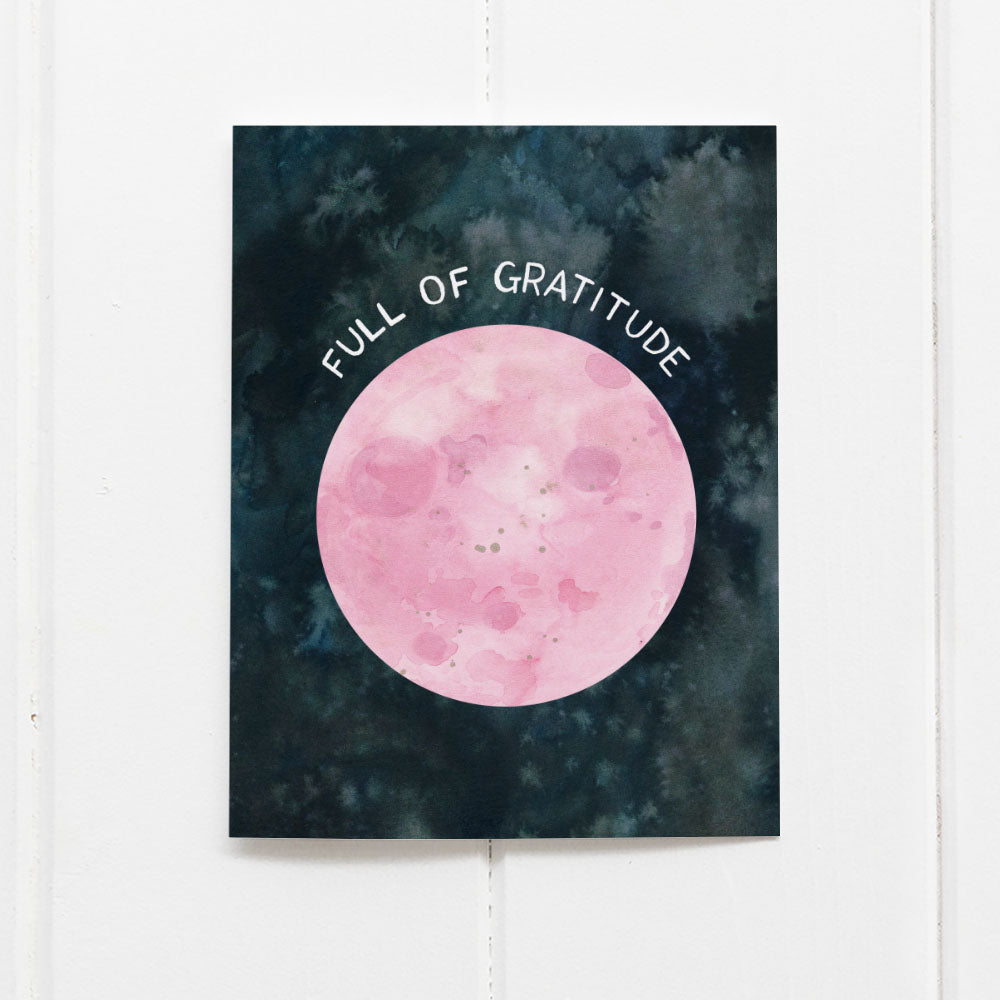 Full Moon Thank You Card with a pink watercolor moon and Full of gratitude message, blank inside, printed on recycled cardstock, accompanied by a kraft envelope.