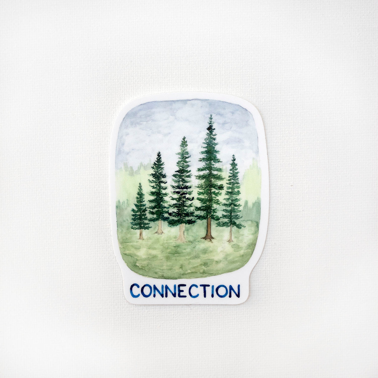 Connection Trees Sticker featuring a watercolor illustration of evergreen trees with the word CONNECTION. Designed by Brigida Swanson, perfect for laptops or water bottles.