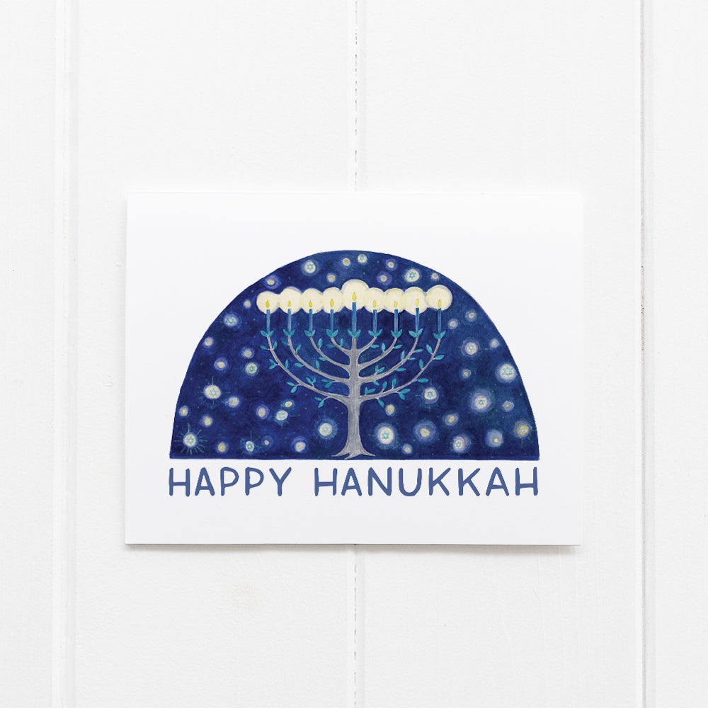 Boxed Hanukkah Cards - Set of 6 featuring a watercolor menorah under a starry sky, with Happy Hanukkah message. Includes envelopes, made from recycled paper.