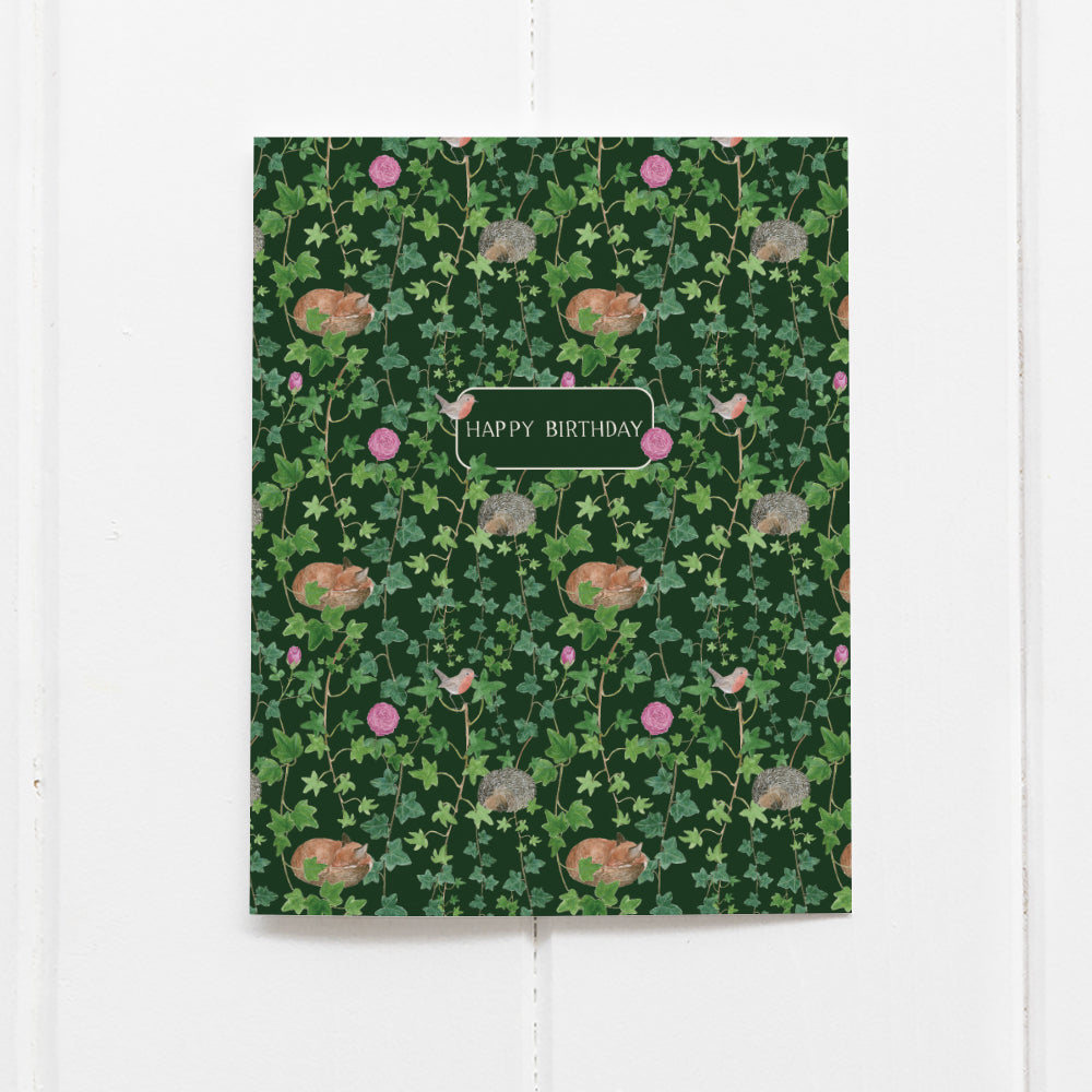 Secret Garden Birthday Card with watercolor vines, roses, hedgehogs, foxes, and robins, hand-lettered HAPPY BIRTHDAY, by Seattle artist Brigida Swanson, blank inside with kraft envelope.
