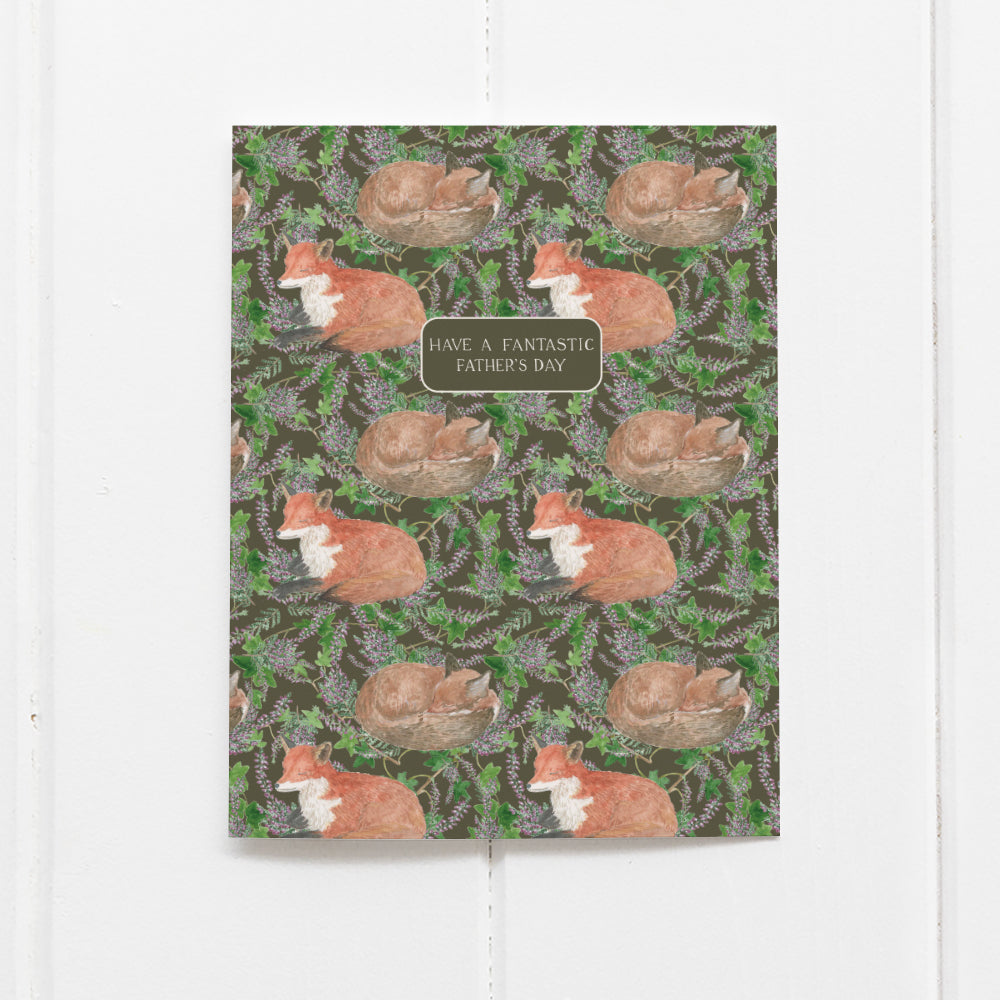 Fantastic Fox Father's Day Card with watercolor foxes amid leaves and blooms, featuring a heartfelt message. Blank inside for personalization. Includes kraft envelope.