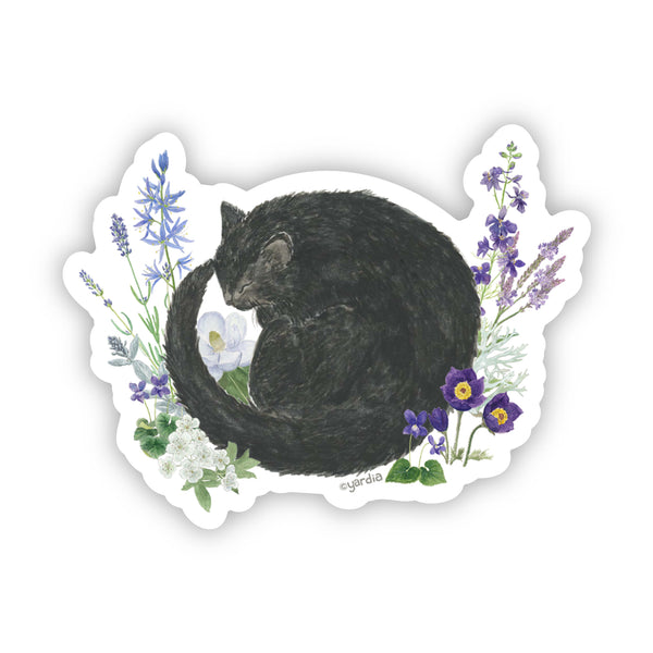 Watercolor vinyl sticker of a black cat sleeping among vibrant flowers, showcasing nature and feline grace. Durable and water-resistant, designed by Brigida Swanson for Yardia.