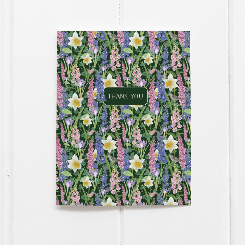 Spring Flowers Thank You Card with floral watercolor design features daffodils, foxgloves, and birds. Front label reads THANK YOU. Blank inside, includes kraft envelope.