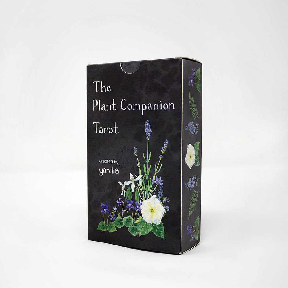 The Plant Companion Tarot set displayed on white background, featuring tarot cards with floral motifs, within a black tuck box