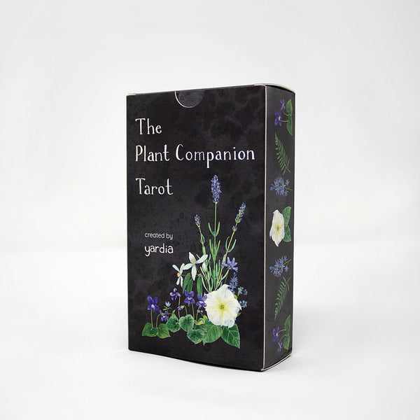 The Plant Companion Tarot set displayed on white background, featuring tarot cards with floral motifs, within a black tuck box