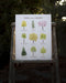 trees of the midwest art print displayed on ladder with garden background