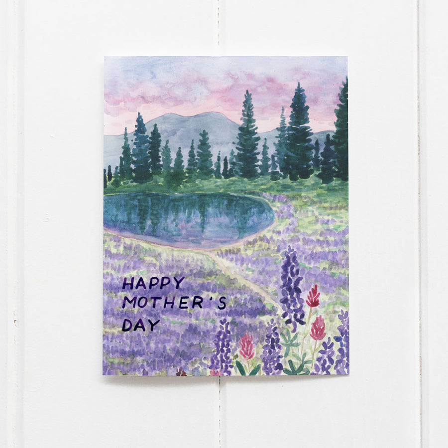Mother's Day Hiking Card featuring a watercolor of Tipsoo Lake with surrounding trees and lupine, blank inside, by artist Brigida Swanson.