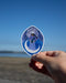 our lady of guam sticker at beach