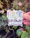 brown and flourishing sticker with wildflowers