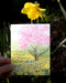 Daffodil Sending You a Garden of Thanks card held up next to daffodil