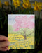 Garden of thanks card with watercolor spring garden illustration set against daffodil flowers