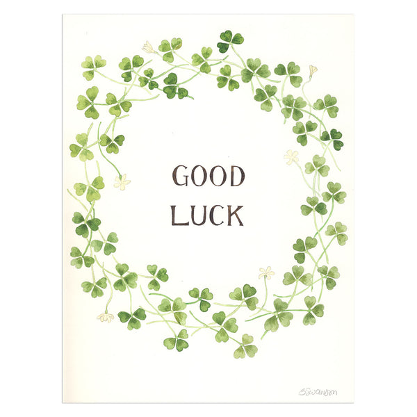 original watercolor painting of green clovers surrounding calligraphy reading good luck
