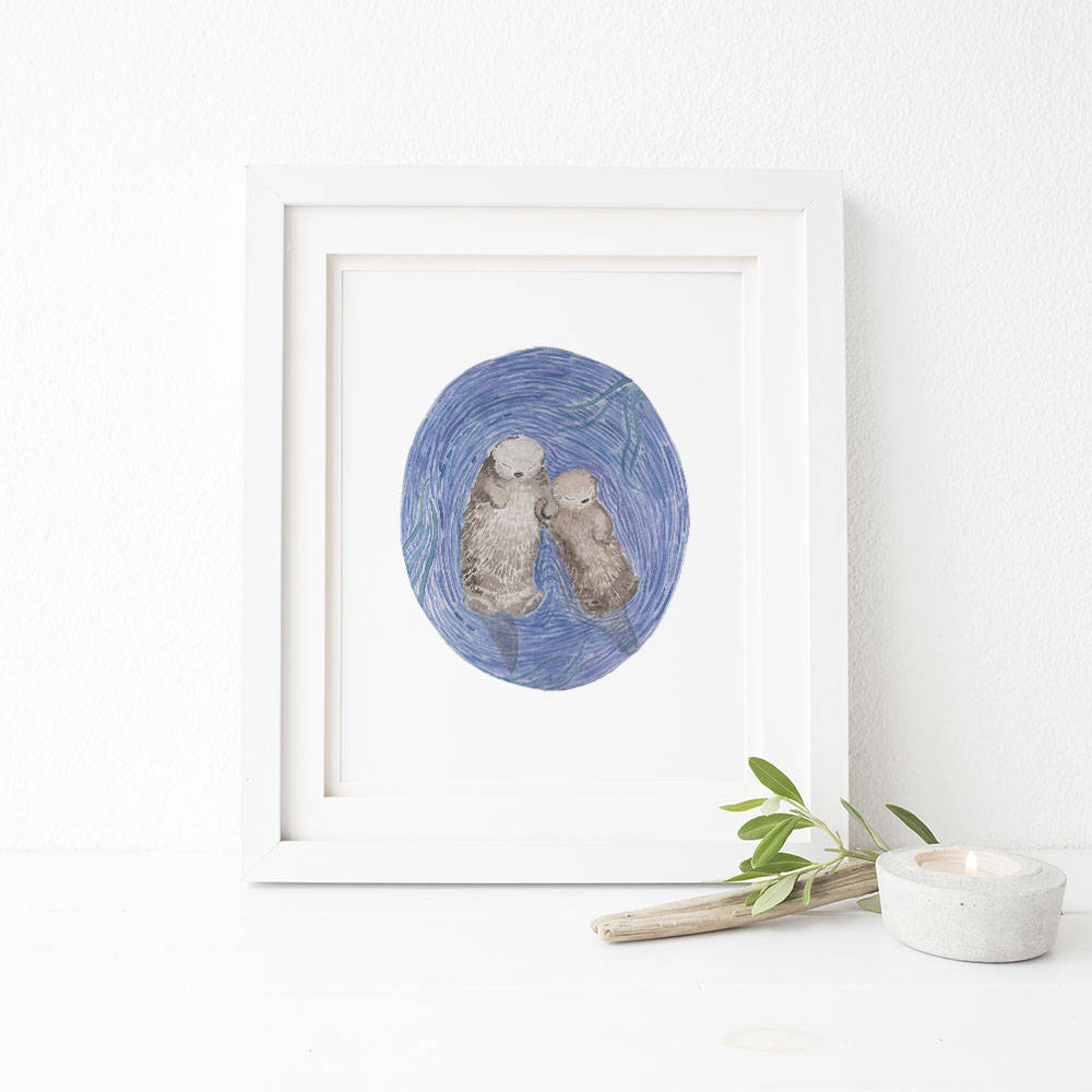 watercolor wall art reproduction with two otters holding hands