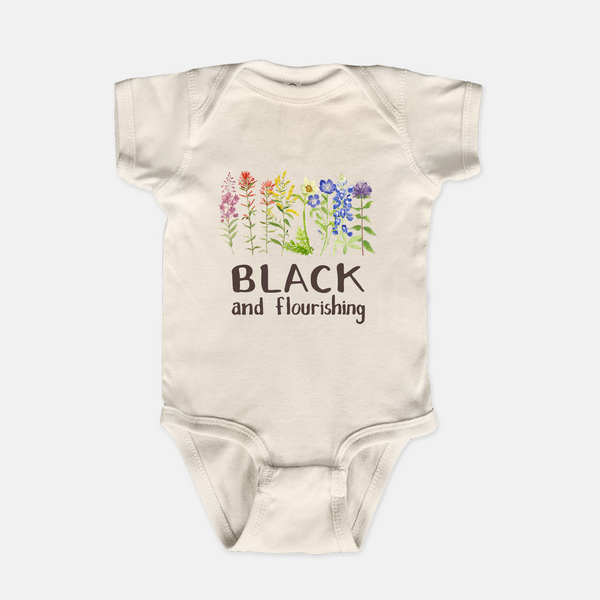 natural baby one piece with Black and flourishing floral design
