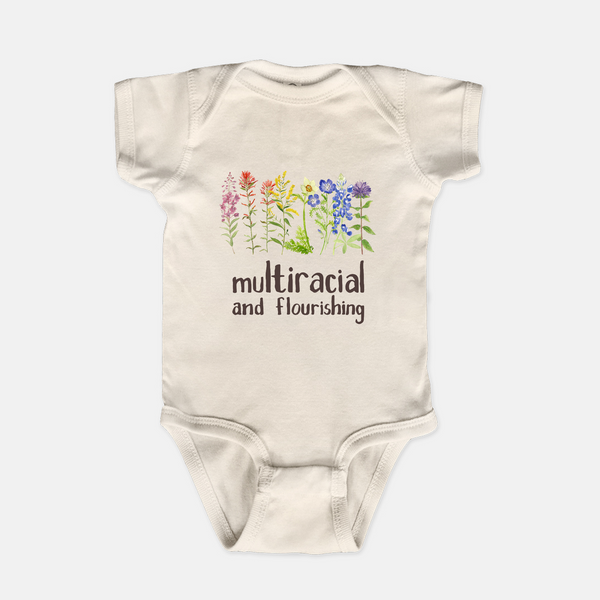 natural baby one piece with multiracial and flourishing floral design