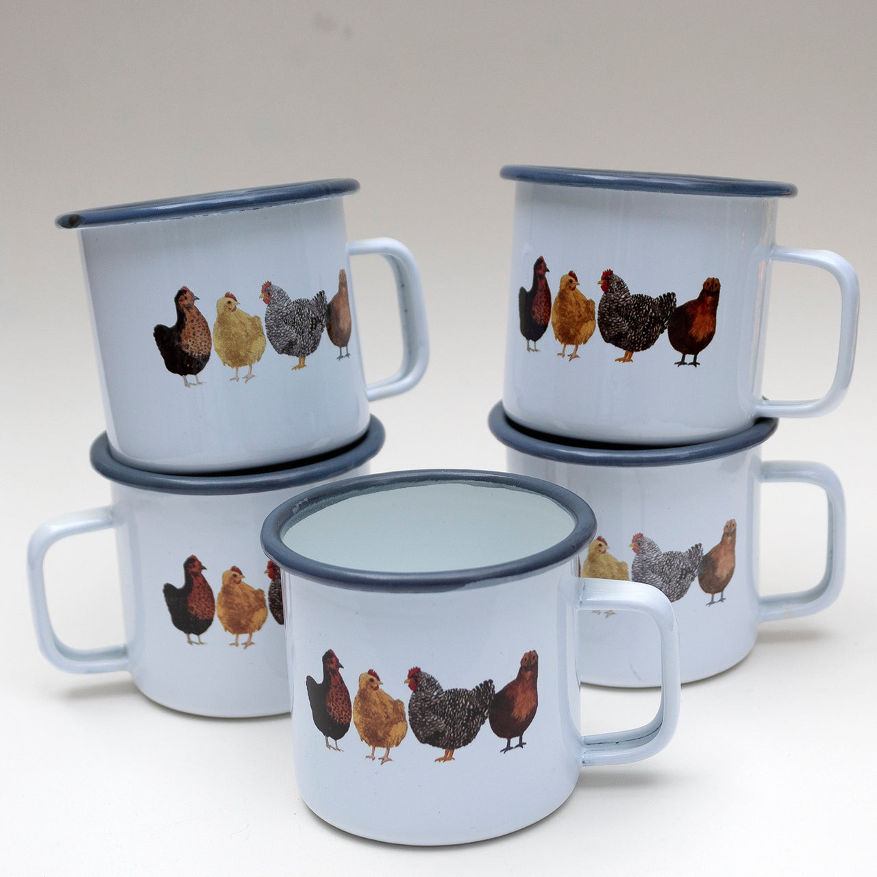 imperfect chicken camp mugs stacked in group