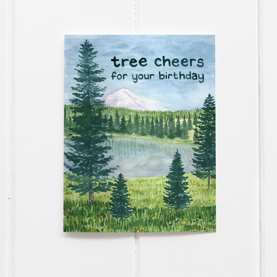 Tree Cheers birthday card featuring a watercolor of Crystal Lakes at Mount Rainier, printed on recycled cardstock, blank inside, with a kraft envelope.